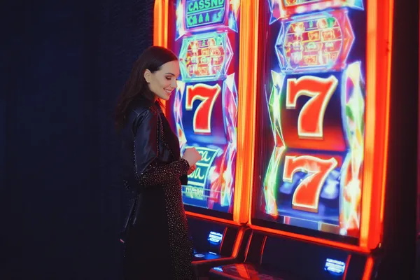 A woman in a luxurious green gown next to an ornate roulette wheel, capturing the upscale casino mood of ZEUS75.