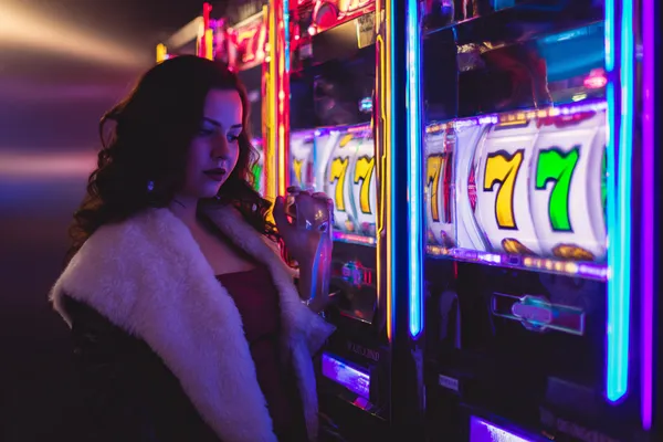 A player using their smartphone during a festive local event, representing ZEUS75’s fully mobile-friendly casino.